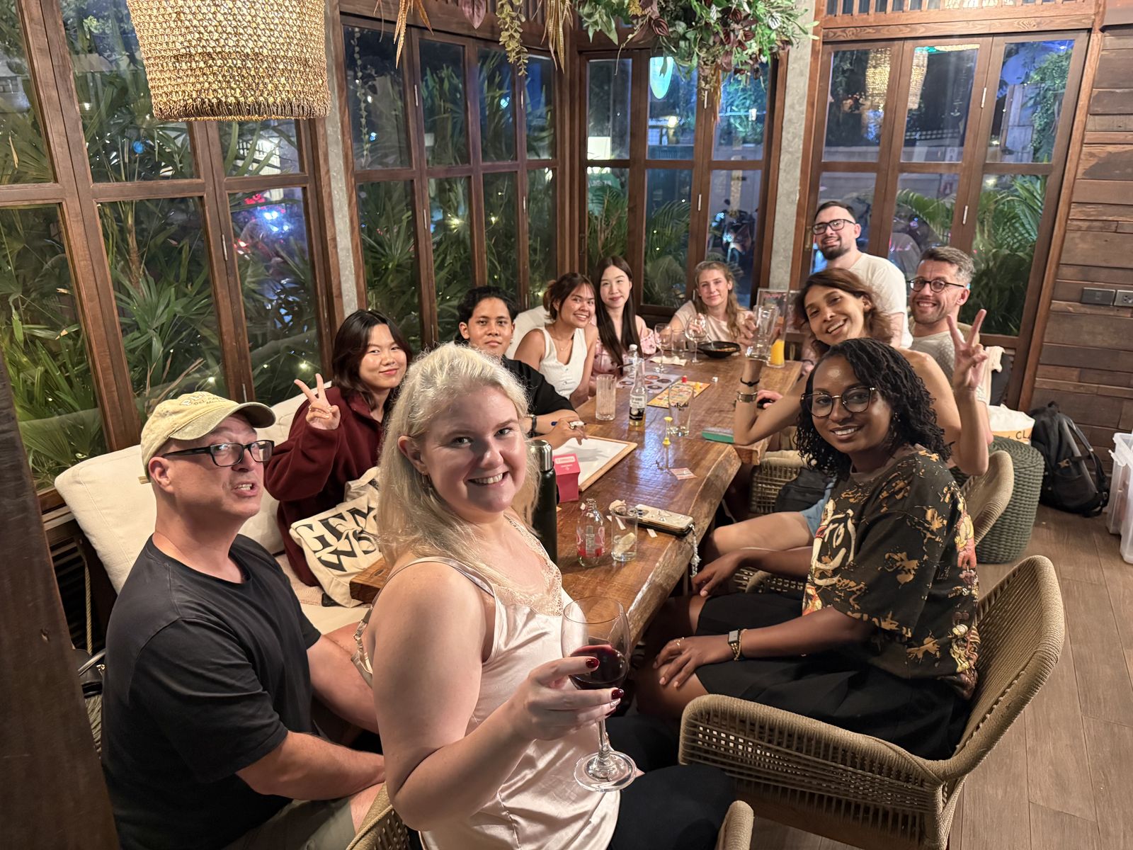 A smiling table of guests at a Crimson Cat Game Night