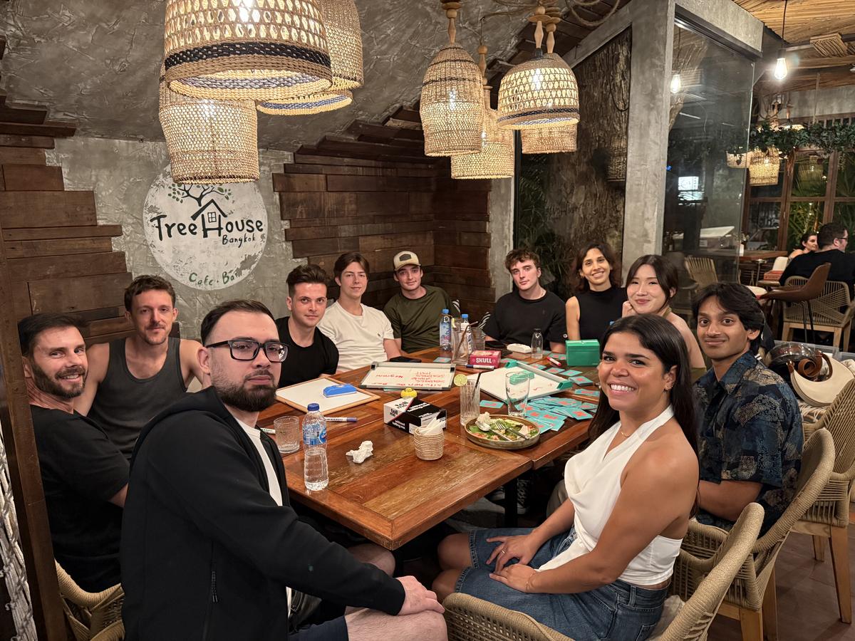 Game Night group seated beneath the Treehouse Cafe & Bar sign.