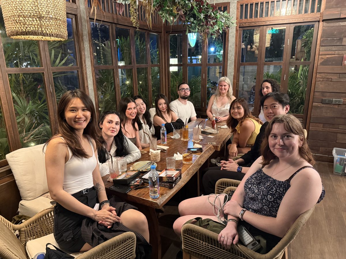 Game Night guests posing together around a long table at Treehouse Cafe & Bar.